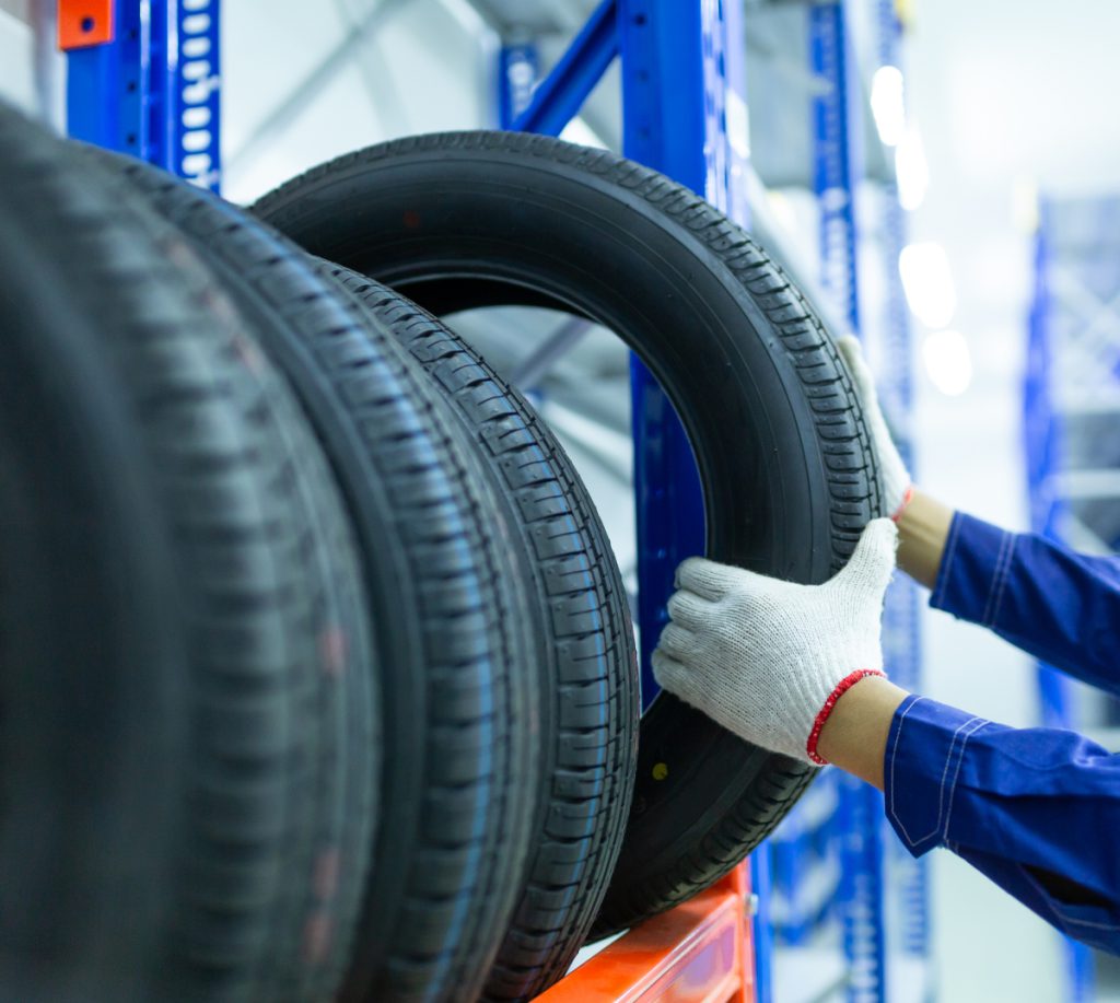 Mechanic picking out a tyre from stock - Tyres Rotherham